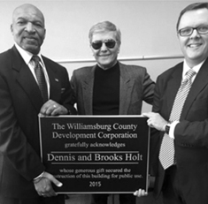 dennis holt with plaque